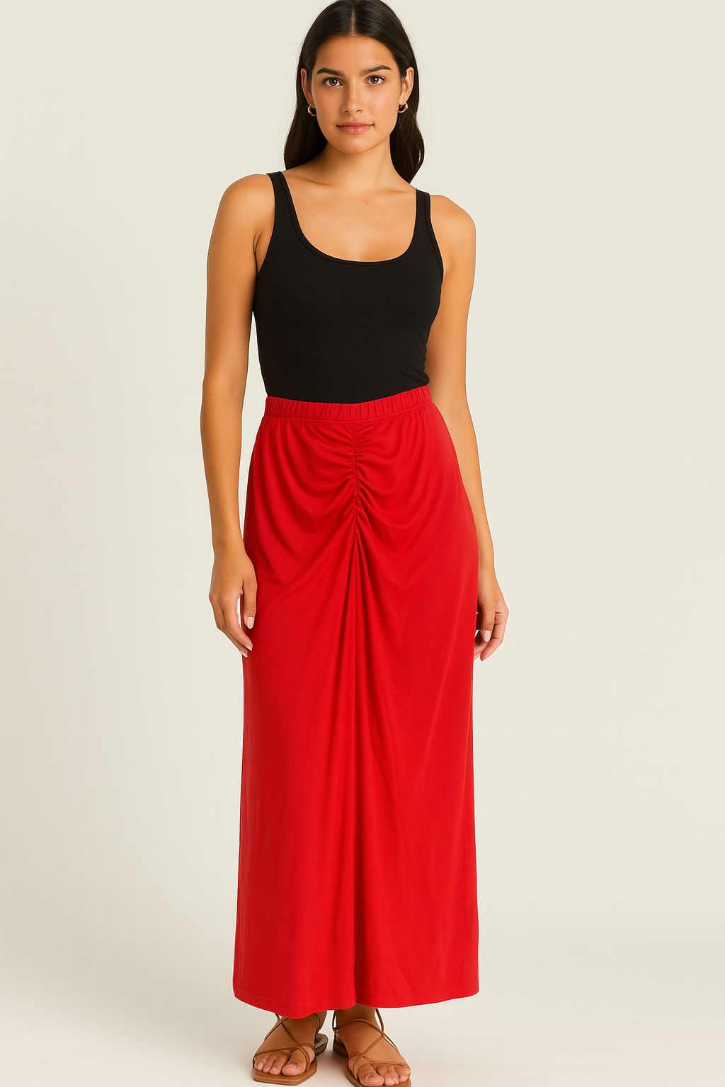Woman wearing a black tank top and red skirt on a beige background