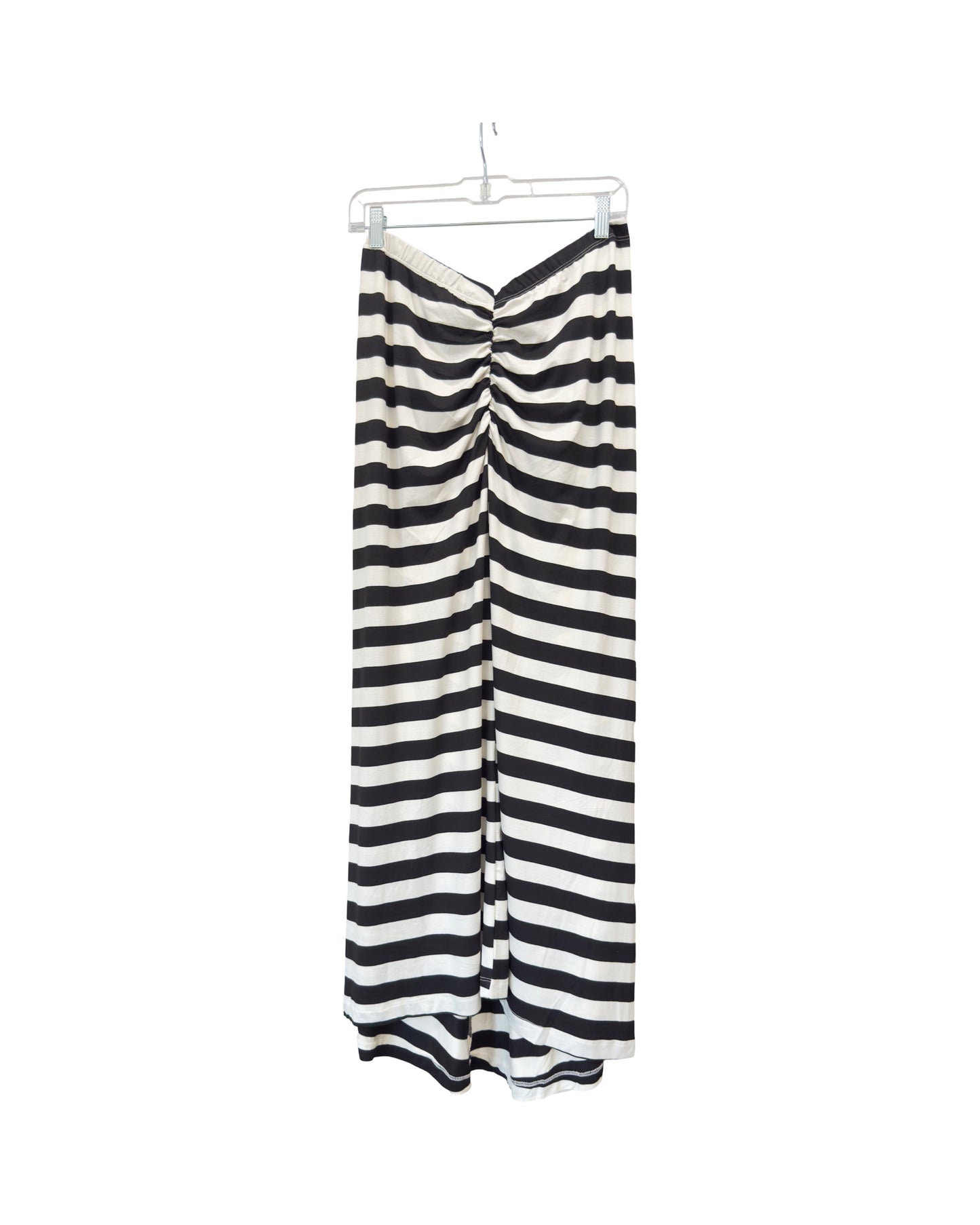 Black and white striped pants on a hanger against a white background